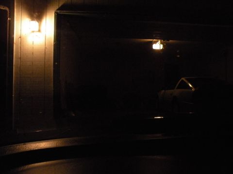 1998 Subaru Legacy - A car is parked inside a dimly lit garage, seen from the side.
