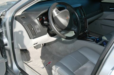 2006 Cadillac STS - The interior of a silver 2006 Cadillac STS features leather seats and a modern dashboard.