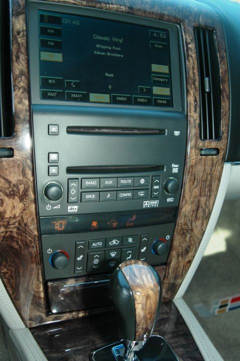 2006 Cadillac STS - Interior view of a 2006 Cadillac STS, highlighting the dashboard and center console with wood grain accents.
