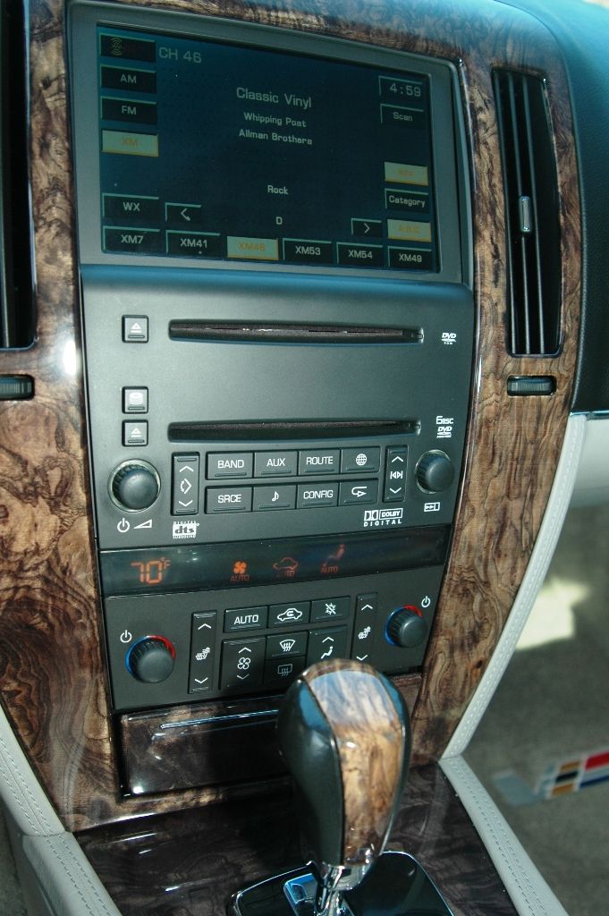 Cadillac center stack with XM radio screen, six-disc changer and burl wood trim