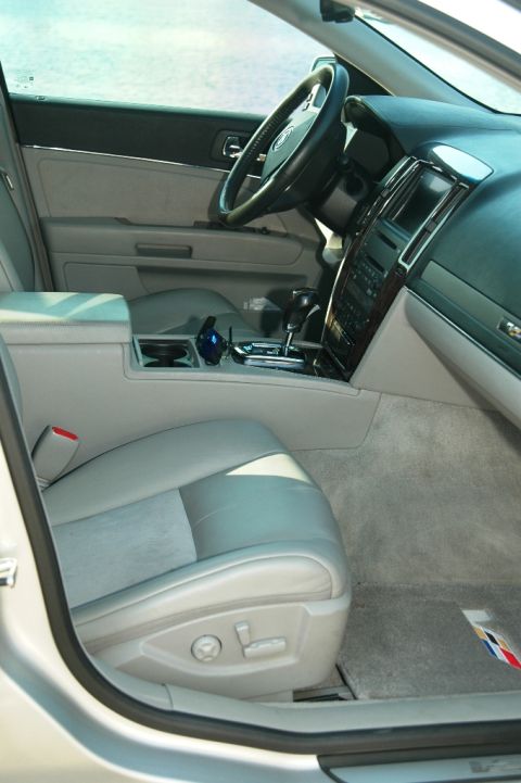 2006 Cadillac STS - The interior of a 2006 Cadillac STS features leather seats and wood trim accents.