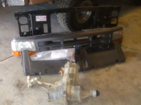 Parts - Bought this pile- complete grill with lights and header pannel, new OEM radiator core support, Lund moon visor with all…