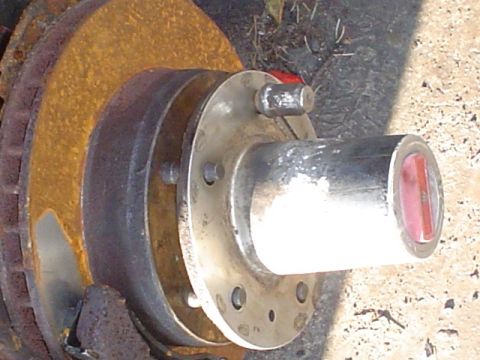 1988 Ford Bronco - Close-up of a heavily rusted brake rotor and hub assembly, showing wear and age.