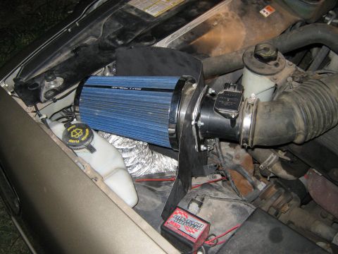 2000 Mercury Grand Marquis - Aftermarket air intake system installed in the engine bay of a vehicle.