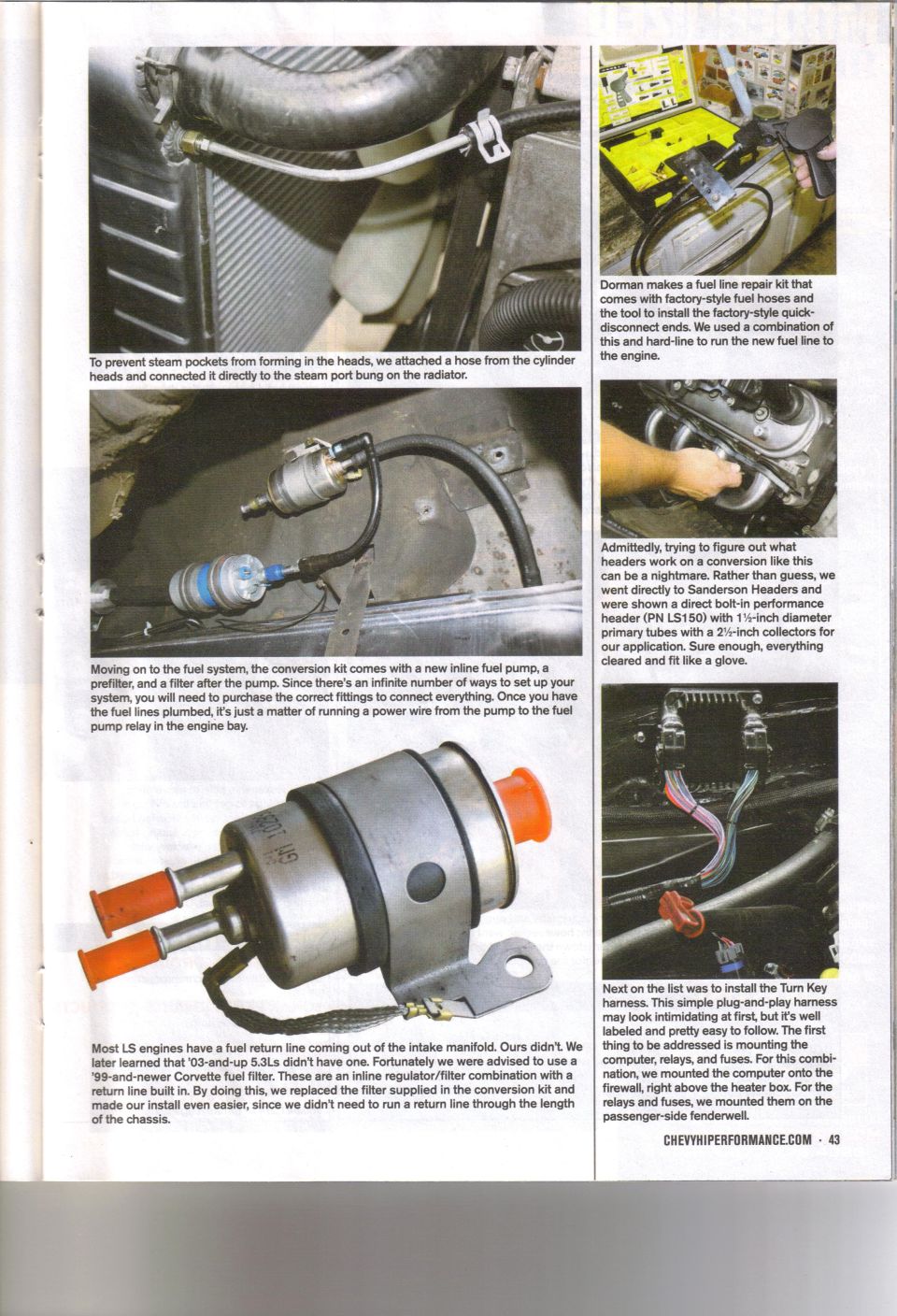 Inline fuel filter with orange caps and metal bracket, next to a radiator hose and engine components