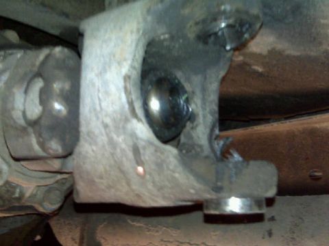 1979 Ford Bronco - This photo shows a close-up view of a vehicle's drivetrain components, likely a U-joint and part of the suspension system.