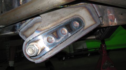 1995 Ford Bronco - Close-up view of a custom-welded suspension component, likely for off-road modification.