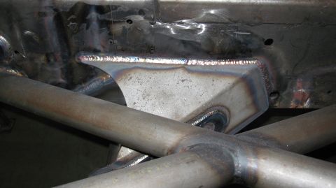 1995 Ford Bronco - Close-up view of custom welded frame reinforcement and crossbars, likely for off-road or performance modification.