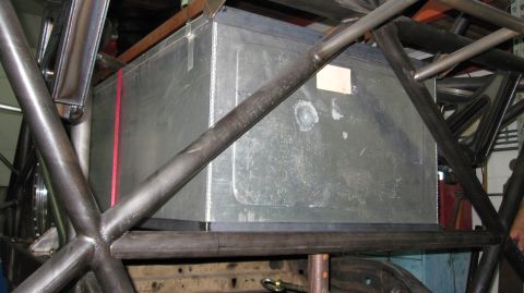 1995 Ford Bronco - Custom fuel tank installation within a vehicle's roll cage structure.