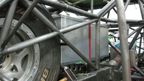 1995 Ford Bronco - Custom roll cage and fuel cell assembly, likely for a race vehicle.