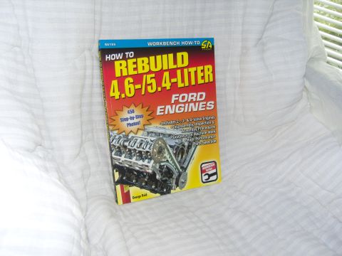 2007 Ford Mustang - Photograph of a Ford engine rebuild how-to book cover, not a document page.