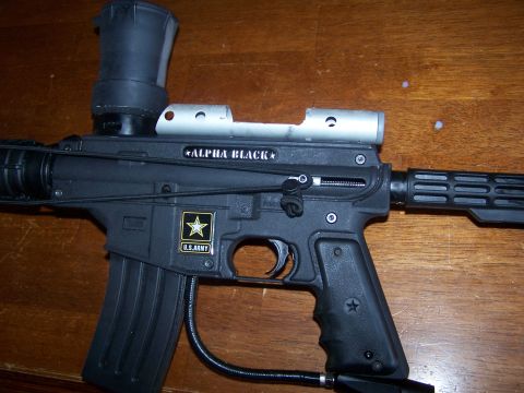 1986 Ford Bronco - Paintball gun labeled Alpha Black with U.S. Army insignia.