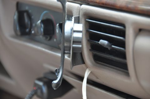 1996 Ford Bronco - Close-up of the interior dashboard of a 1996 Ford Bronco, highlighting the climate controls and air vent.