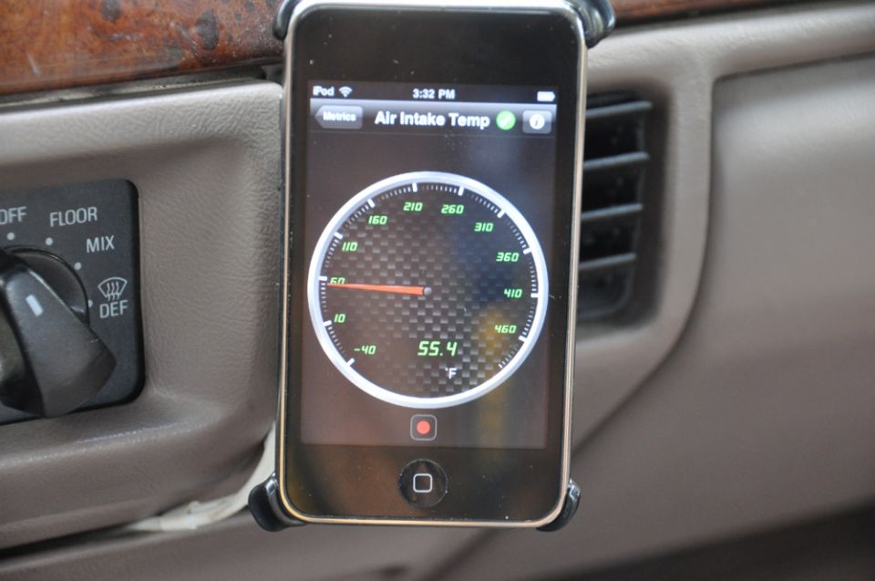 iPhone mounted on dashboard displaying air intake temperature gauge reading 55.4 F