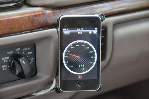 1996 Ford Bronco - An iPhone displays engine coolant temperature on a dashboard-mounted app.