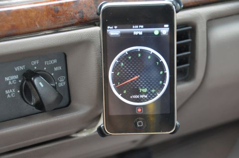 1996 Ford Bronco - An iPhone mounted on the dashboard displays an RPM gauge application, with vehicle climate controls visible to the left.