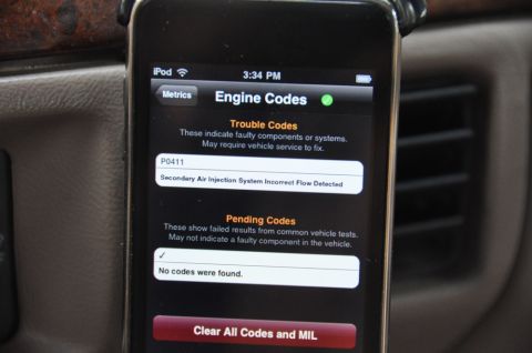 1996 Ford Bronco - A smartphone displays diagnostic trouble codes, indicating a P0411 error for the secondary air injection system.