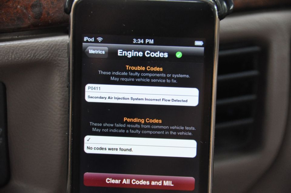 Smartphone displaying engine codes, showing a P0411 trouble code and no pending codes