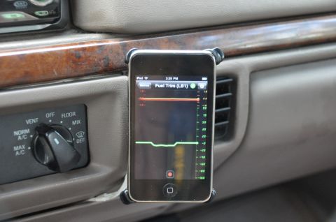 1996 Ford Bronco - An iPhone is mounted on the dashboard, showing a graph of fuel trim data.