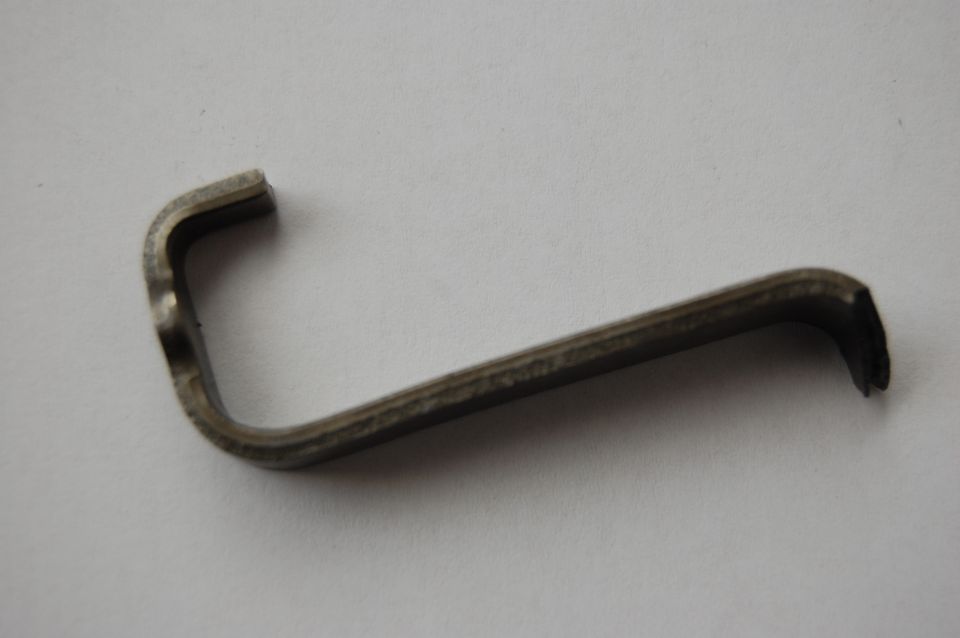 Metal clip with a bent L-shape and a long shaft