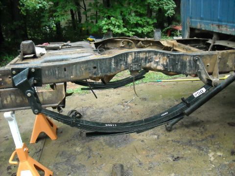1979 Ford F-150 - Leaf springs and frame of a truck undergoing maintenance or repair.