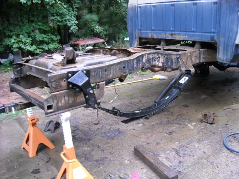 1979 Ford F-150 - The rear leaf springs of a truck are visible, with the number '950' clearly marked on them.
