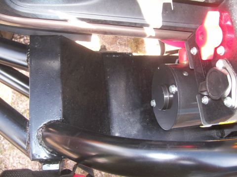 1993 Ford Bronco - Close-up of an aftermarket winch and tow hook assembly attached to black tubing, likely part of a custom bumper or frame modification.