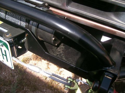 1993 Ford Bronco - Close-up of a winch and bumper assembly, showing steel cables and mounting hardware.