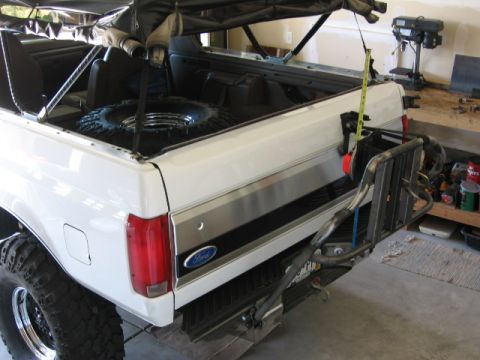 1995 Ford Bronco - Rear view of a 1995 Ford Bronco with a custom tire carrier and spare tire mounted.