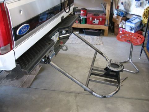 1995 Ford Bronco - Custom tire carrier assembly attached to the rear bumper of a 1995 Ford Bronco.