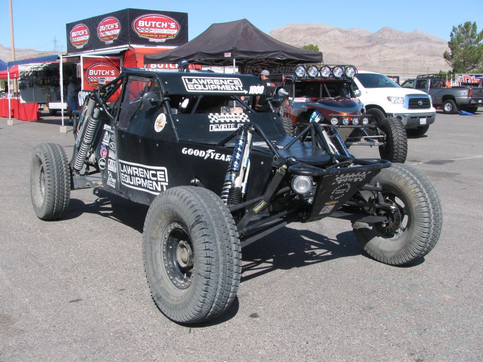 Black Lawrence Equipment tube-frame off-road buggy in desert pit area