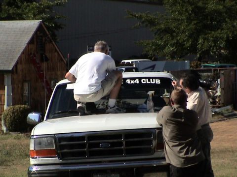 1996 Ford Bronco - Kurt Putting on my 2 Big Broncos 4x4 Club Windshield Sticker.(8/10/2002)