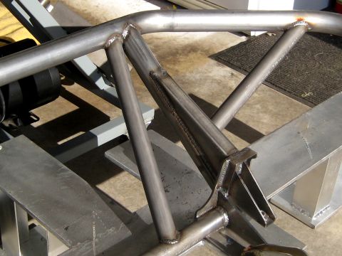 1996 Ford Bronco - Close-up view of welded steel tubing forming a custom roll cage structure.