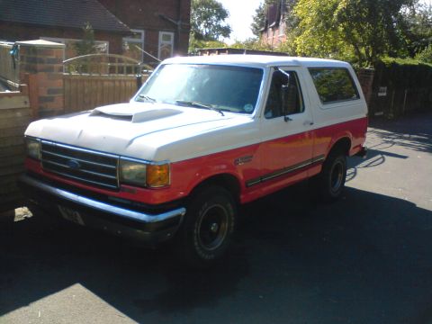 1989 Ford Bronco - This two-tone Ford Bronco, likely from the late 1980s, is seen from a three-quarter front angle.
