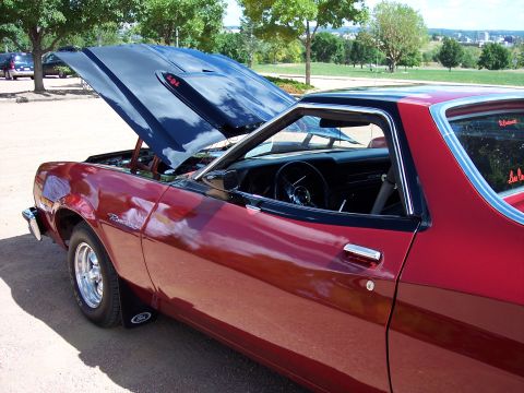 1972 Ford Ranchero - 1972 Ford Ranchero with hood open, parked outdoors on a sunny day.