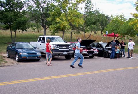 1972 Ford Ranchero - Several vehicles are parked and displayed at an outdoor gathering.