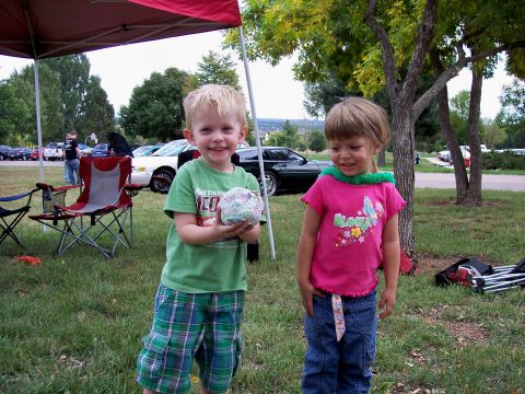 1972 Ford Ranchero - Two children pose for a photo at an outdoor gathering with cars in the background.