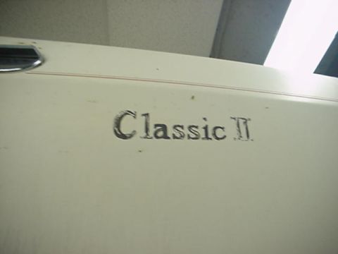1977 Ford Mustang II - Emblem reads 'Classic II' on a vehicle's exterior panel.