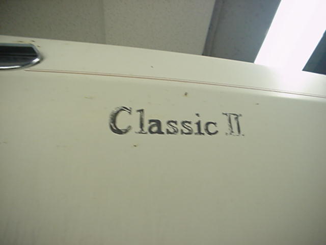 Close-up of 'Classic II' emblem on a car's body panel