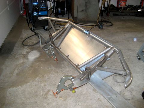 1996 Ford Bronco - Custom metal fabrication project being worked on with welding equipment nearby.