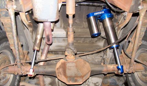 1984 Ford Bronco - This photo shows the rear axle and suspension of a vehicle, upgraded Pro-Tech shocks.