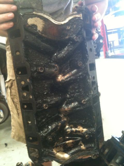 1990 Ford C-150 (Centurion Conversions) - This intake manifold is covered in thick, black sludge and grime.