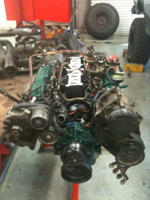 1990 Ford C-150 (Centurion Conversions) - Engine removed from vehicle and placed on a stand for service or repair.