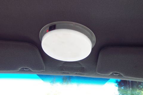 2001 Ford Crown Victoria - The interior dome light is visible above the windshield, with sun visors on either side.