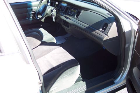 2001 Ford Crown Victoria - Interior view of a 2001 Ford Crown Victoria, highlighting the dashboard and seating.