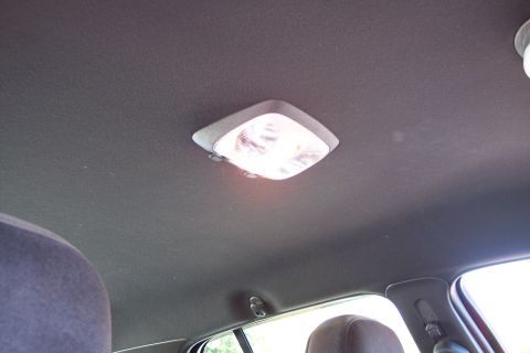 2001 Ford Crown Victoria - Close-up of a car's interior dome light.