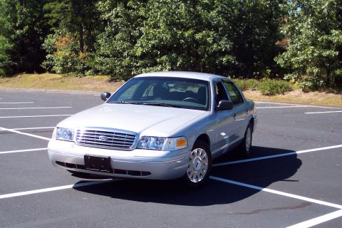 2001 Ford Crown Victoria - Silver 2001 Ford Crown Victoria parked in a lot.
