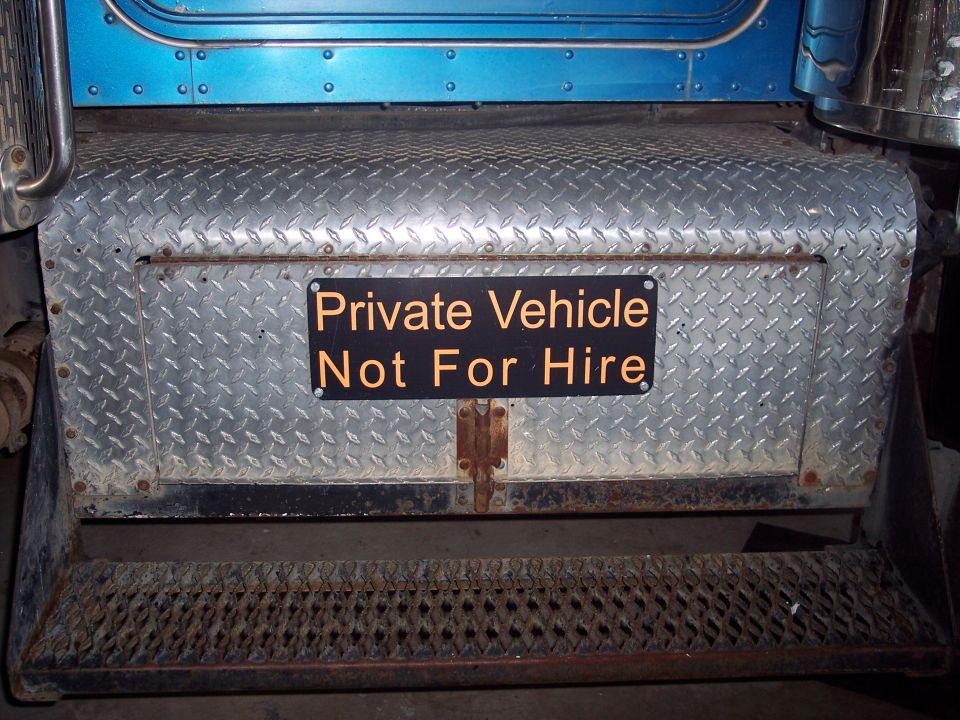 Diamond plate steps on a truck with a sign that says 'Private Vehicle Not For Hire'