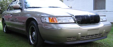 2000 Mercury Grand Marquis - The front grille and headlight design are consistent with a 2000 Mercury Grand Marquis.