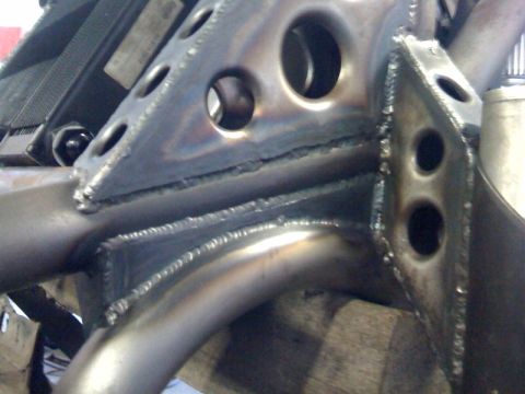 1994 Jeep YJ - Detail of a custom-welded frame section, likely for an off-road vehicle build.